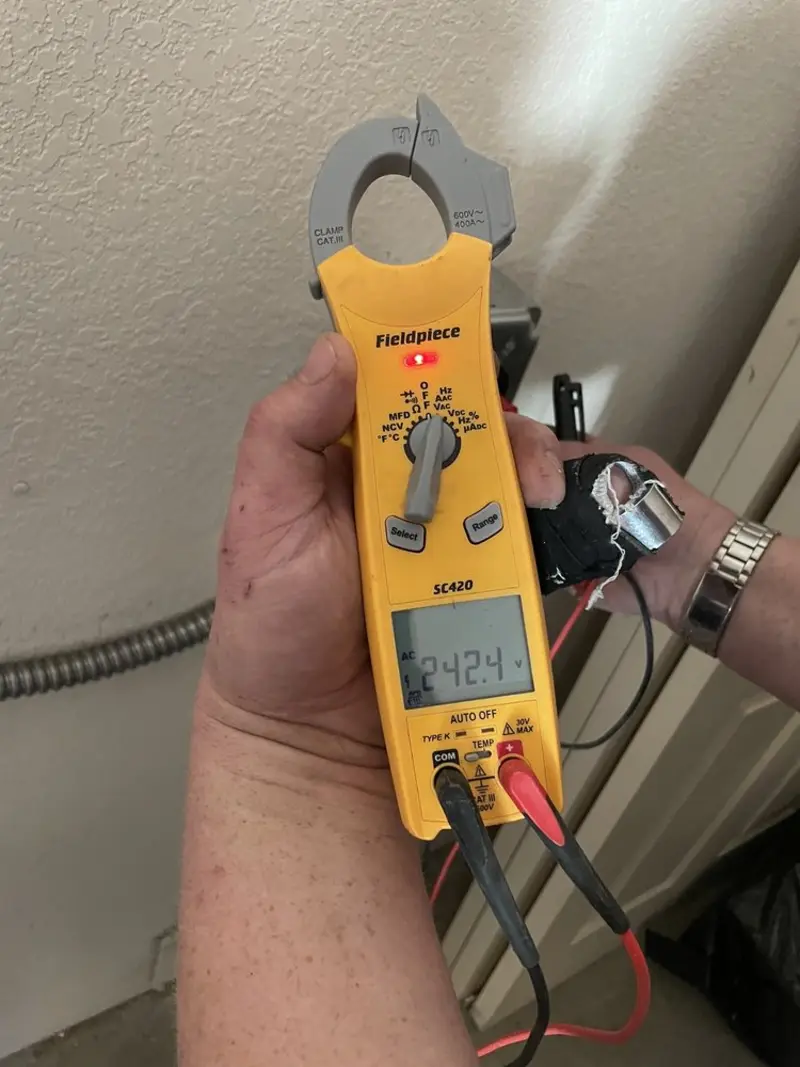 Voltage testing with clamp meter during Circuit Breaker Repair in Newton